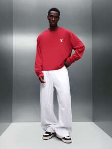 PLAYBOY X SUMWON Men's Boxy Fit Long Sleeve Crew Neck T-Shirt With Access Granted Print Collaboration Statement Top - Red - View 4