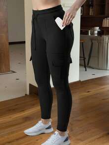 Muchica 黑色针织弹力女式紧身裤，女士春/秋休闲抽绳，口袋自然紧身七分黑色紧身女式裤子，休闲日常穿着