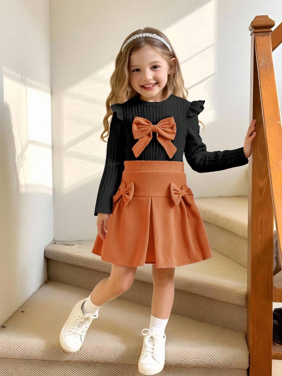 Elladie kids 4-7歲女童休閒甜美白色針織提花蝴蝶結裝飾荷葉邊長袖圓領上衣 & 粉色燈芯絨彈性腰褶皺裙,適合日常穿著、休閒出遊,女童蝴蝶結裙組、橘色裙組、女童兩件套裙裝 - 彩色 - 查看 1