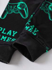 1 Set Tween Boys Glow-In-The-Dark Video Game Print Knit Snug Fit Long Sleeve Top And Matching Allover Print Pants Pajama Set 2-Piece Set - Black Green Gaming Pajamas Glow UV Gaming Controller Print Crew Neck Design Black Green Esports Gaming Color Elastic Fitted Fabric Long Sleeve Crew Neck Fitted Top Cuffed Pants Gaming Controller Combo Social Media Style Esports Gaming Spring Summer Autumn Winter Holiday Essential Big Boys Fitted Home Set .This Product Requires UV Light Exposure To Glow. - Black - View 4
