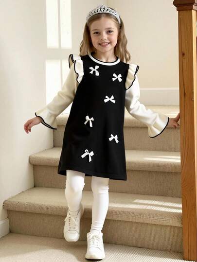 Elegant Girls' Knitted Sweater Dress, Featuring Classic Black And White Contrast, Sweet Bow Decorations, And Ruffle Sleeves, Perfectly Matches Modest Fashion For Festival, Made From Soft, Comfortable Fabric Suitable For Spring And Fall, This Dress Is Ideal For Family Gatherings, Parties, And Festive Celebrations. Inspired By Popular Children's Clothing Styles, It Offers A Sophisticated Look And Excellent Comfort, Making It A Top Choice For Gifting And Holiday Wear