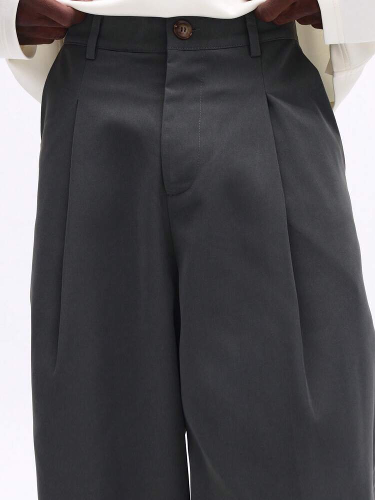 Pantalon plissé à jambes larges avec fermeture éclair