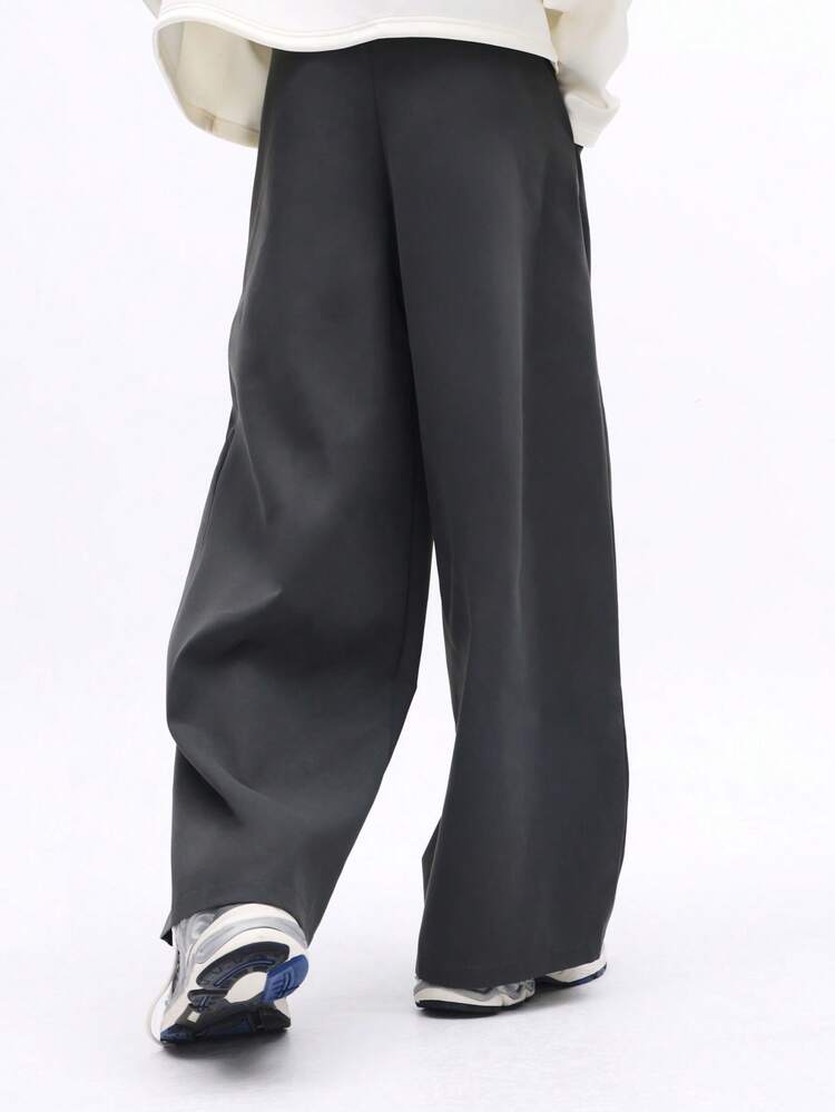 Pantalon plissé à jambes larges avec fermeture éclair