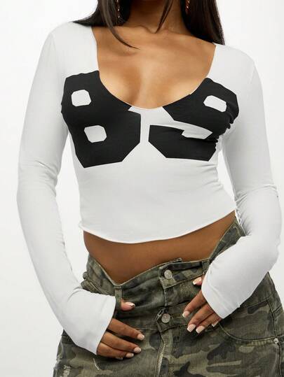 Blusa de manga comprida com estampa de bolinhas