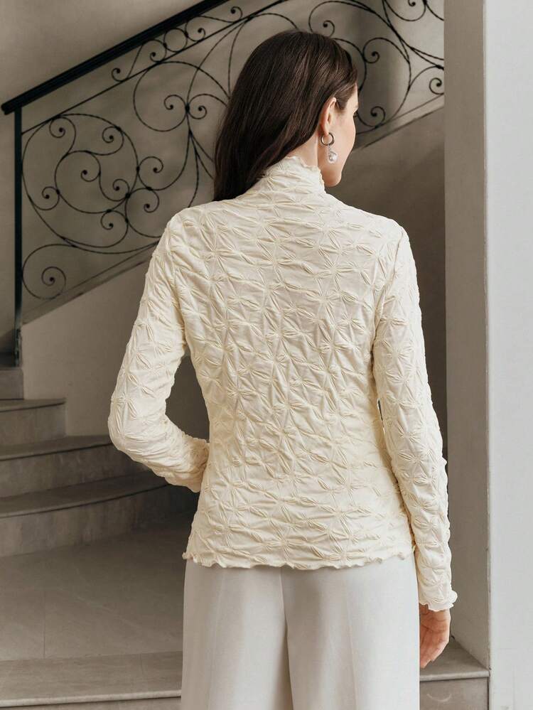 T-shirt de mode à col roulé texturé à manches longues de couleur unie pour femmes