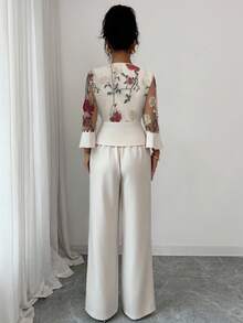 Elenzga Elegantes Set in Große Größen mit floraler Stickerei, transparentem V-Ausschnitt und Langarmoberteil sowie Hose