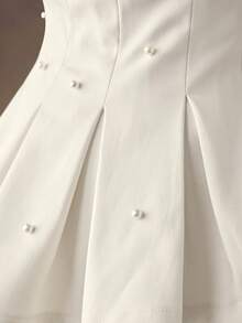 SHEIN BAE Weiße, schulterfreie Jacke mit Perlenverzierungen für Herbst/Winter. Dieser weiße, schulterfreie Blazer mit Perlenapplikationen strahlt Eleganz aus. Perfekt für Partys, Weihnachtsfeiern, Geburtstagsfeste und festliche Anlässe.