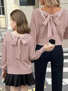 SHEIN Serisse Kids 这款少女休闲时尚百搭针织套头毛衣，采用波浪下摆、V领、后背蝴蝶结和灯笼袖设计，适合周末、休闲外出、返校、圣诞节、新年等秋冬季穿着。 - 藕粉色 - 查看 9