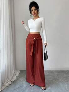 Elenzga Pantalones casuales versátiles de estilo bohemio occidental de cintura alta en color marrón óxido, con diseño de tejido trenzado, hebilla metálica cruzada asimétrica, cremallera lateral y pierna recta, adecuados para mujeres de 20 a 35+ años para uso diario, primavera y otoño - Óxido marrón - Ver 6