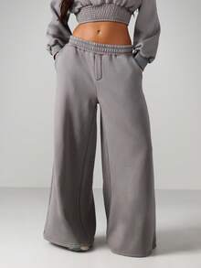 MISSGUIDED Pantalones de chándal holgados y lavados con pernera ancha, con cintura elástica y bolsillos laterales para uso casual en casa - Gris Oscuro - Ver 1