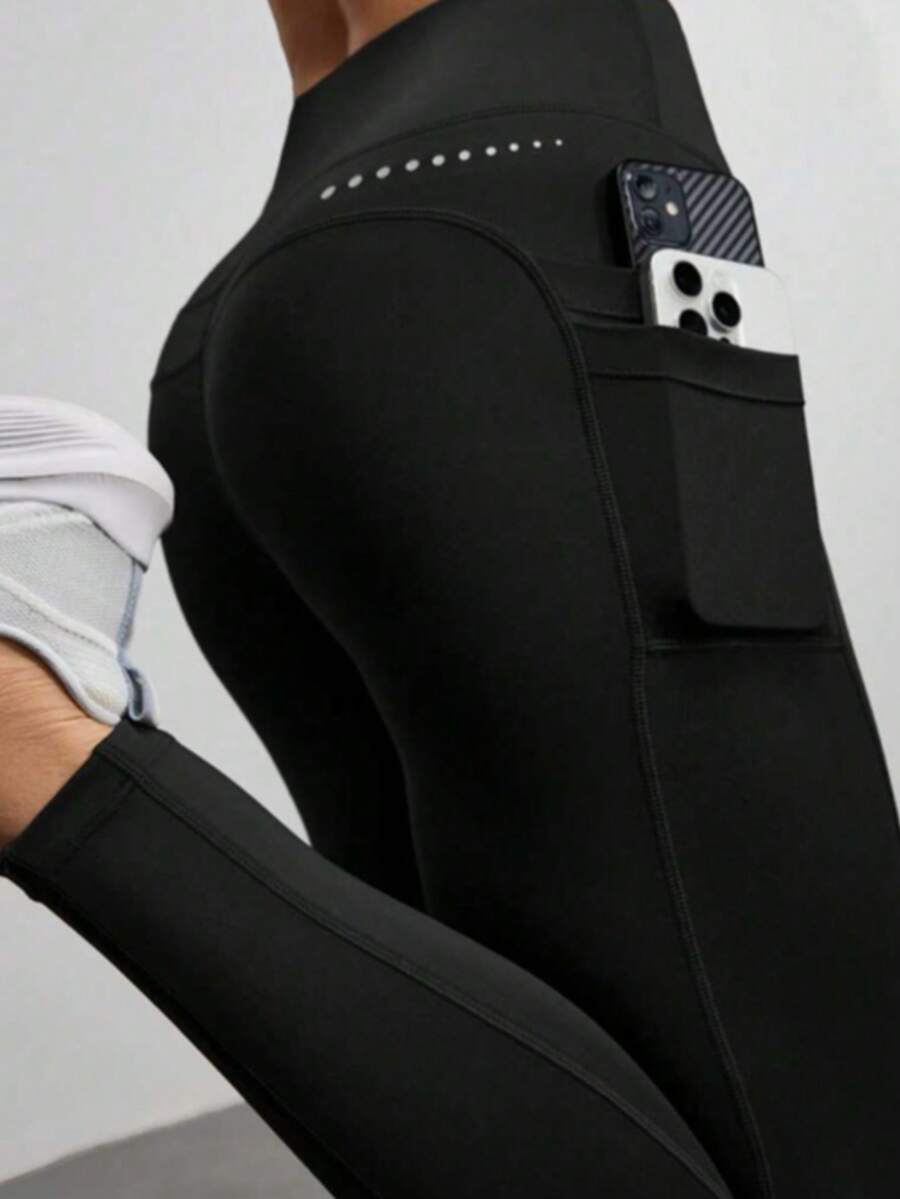 Pantalones cortos deportivos de cintura alta con bolsillos, ajustados y de corte slim para mujer - Negro - Ver 1