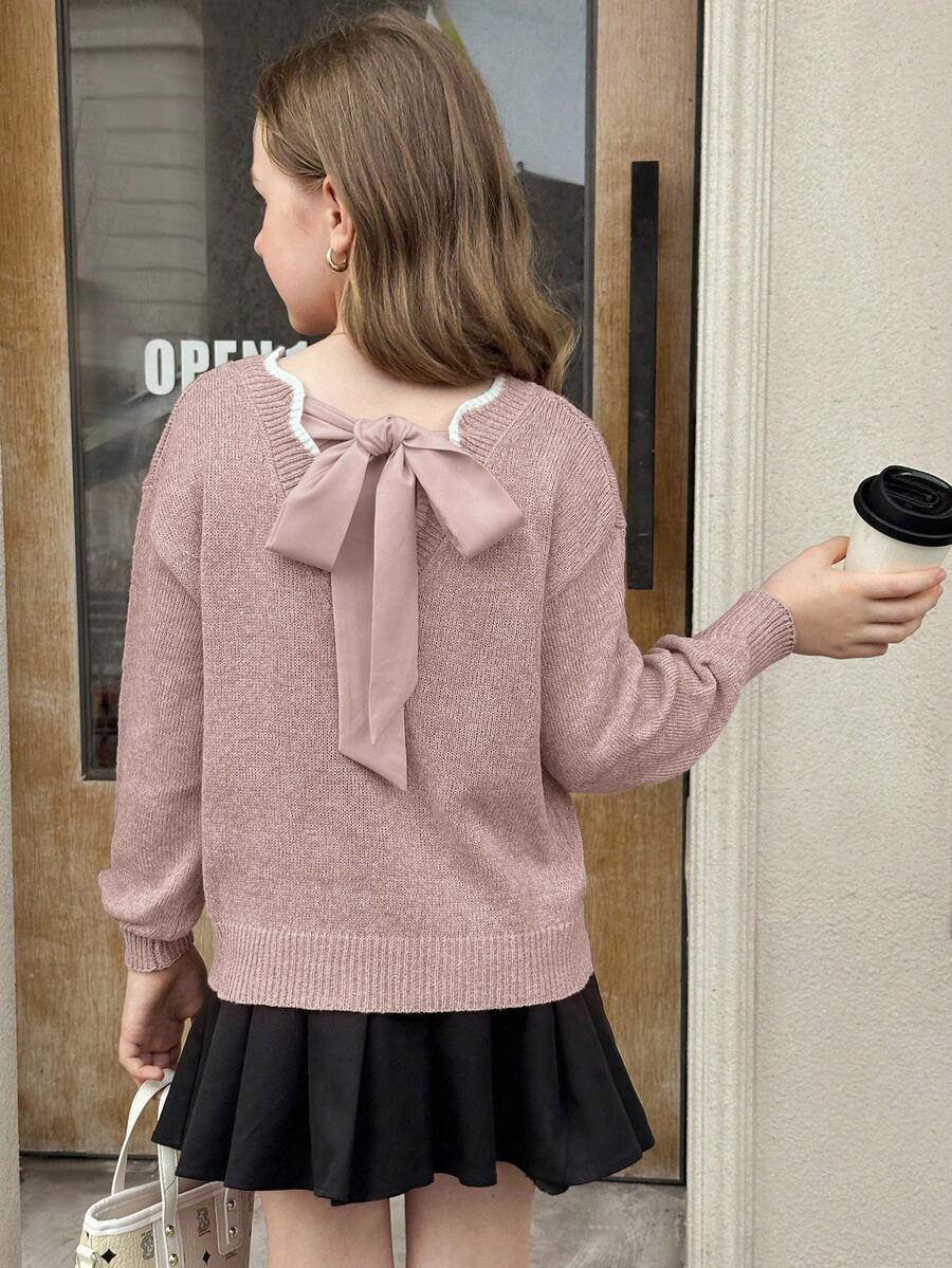 SHEIN Serisse Kids 这款少女休闲时尚百搭针织套头毛衣,采用波浪下摆、V领、后背蝴蝶结和灯笼袖设计,适合周末、休闲外出、返校、圣诞节、新年等秋冬季穿着。 - 藕粉色 - 查看 1