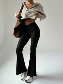 1 par de pantalones joggers acampanados de cintura alta para mujer, con bolsillos laterales y silueta bootcut, diseñados como pantalones informales. - Negro - Ver 3