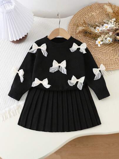 SHEIN Playful Pals 女童燕麦色手工欧根纱蝴蝶结圆领落肩长袖毛衣+配套百褶裙，柔软舒适，适合日常、户外、旅行、度假、居家、托儿所和儿童玩耍。黑白儿童裙，黑色裙子，适合幼儿秋冬季穿着，女童蝴蝶结裙，女童长袖裙。