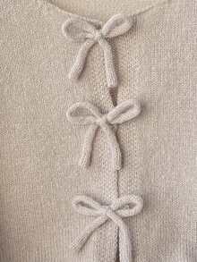 SHEIN 女童基础款休闲蝴蝶结装饰纯色圆领长袖宽松短款开衫毛衣，保暖舒适，时尚百搭，适合日常通勤、秋冬季节穿着，也可与母女搭配。返校季、居家穿着皆宜。可爱、复古、优雅。 - 藕粉色 - 查看 5