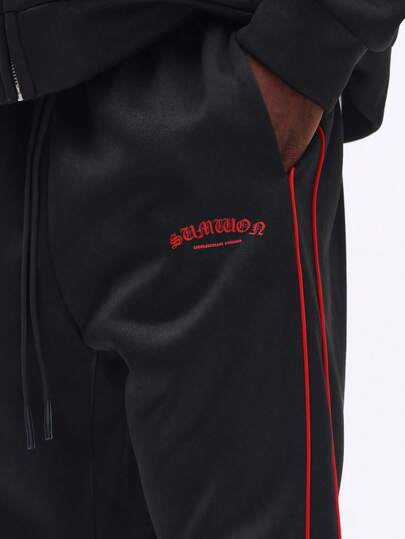 Flared Sweatpants With Red Side Stripes
