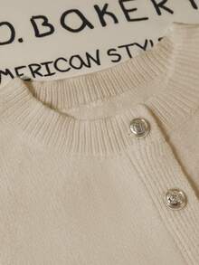 GlowEve 女士时尚腰部收紧荷叶边下摆短款开衫，独特金属纽扣装饰，别致的白色毛衣