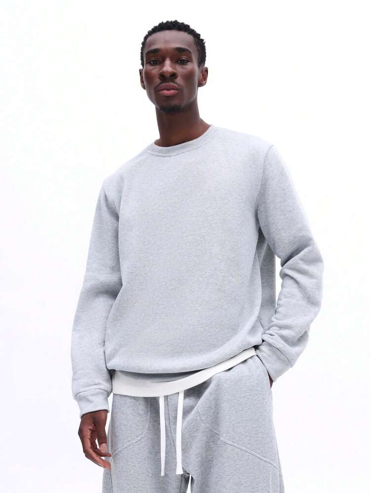 杢グレーのクルーネックスウェットシャツ