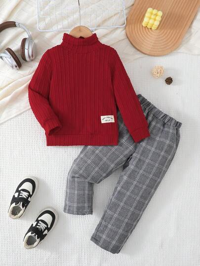 SHEIN Vintaside Kids 2pcs Young Boy Casual Outfit, Black Ribbed Sweater + Plaid Pants, Paired With White Sneakers, Showcasing Cute And Style! The Classic Black Top Adds Depth And Vitality. Paired With Fashionable Gray Plaid Pants, The Overall Look Is Casual Yet Refined. Stepping Into White Sneakers, Easily Creating A Vibrant And Energetic Young Boy Image, Allowing The Child To Express Their Unique Personalized In Happiness!