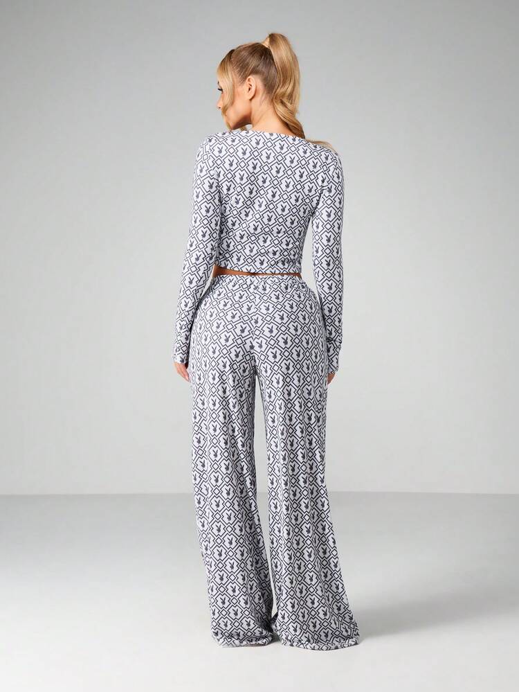 Missguided x Playboy Printed Long Sleeve Crop Top And Wide Leg Trouser Two Piece Lounge Set With Monogram Pattern For Loungewear And Casual Wear