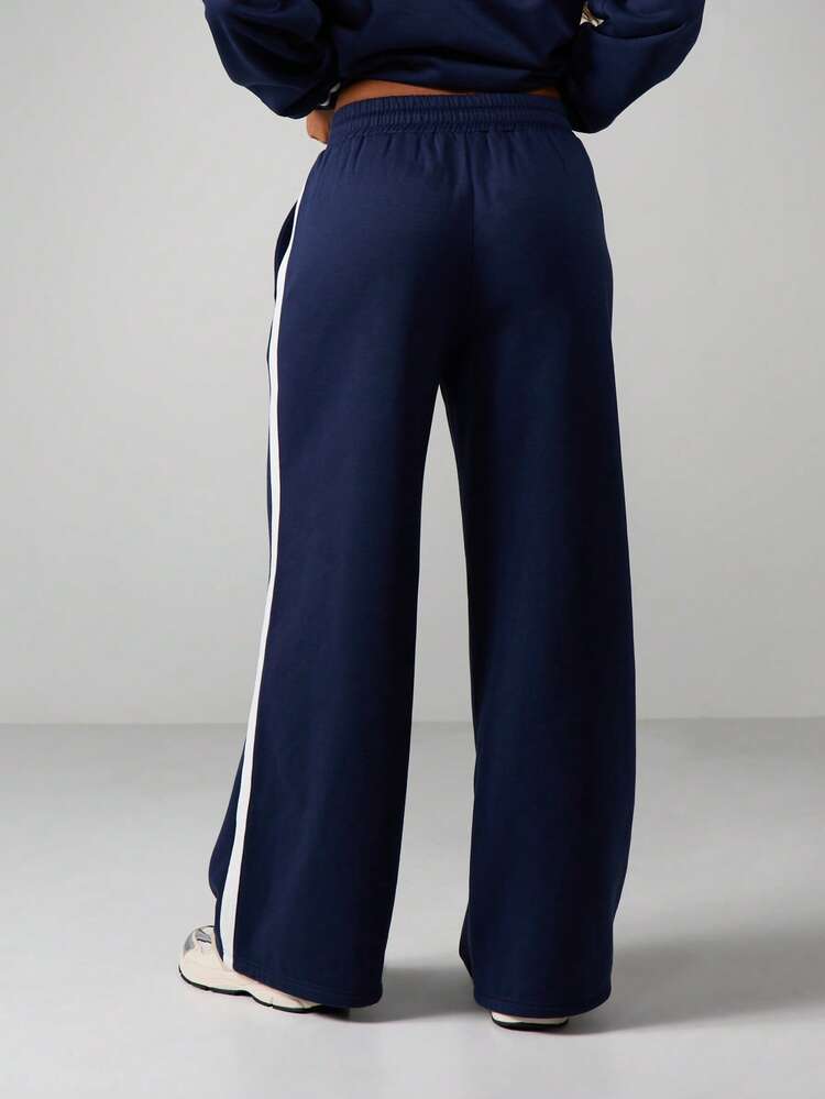 Missguided x Playboy Pantalones jogger de pierna ancha con detalles de rayas laterales y cintura con cordón para comodidad casual