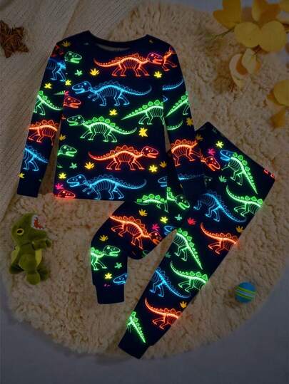 Snug Fit Young Boys Pajamas-2 Piece Pajama Set Navy Neon Dinosaur Print Round Neck Long Sleeve Top Long Pants Sleepwear Cozy Stretchy Elastic Waist Four Season 2026 New Year Holiday Essential Bedtime Gift Playful Cartoon Glow Nighttime Comfortable This Product Requires UV Light Exposure To Glow