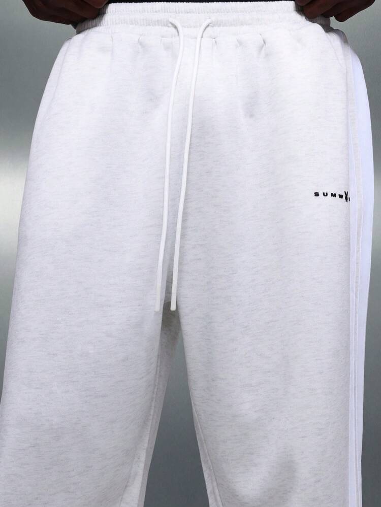 PLAYBOY X SUMWON Relaxed Fit Sweatpants With Side Stripe Detail And Small Logo Embroidery For Casual Loungewear And Weekend Comfort