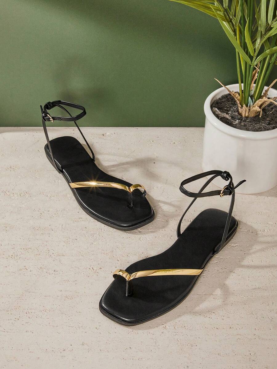 SHUZIA #UrbanLuxe Women's Electroplated Gold TPU Strap Black Ankle Wrap Ring Toe Flat Sandals – Elegant, Minimalist & Luxurious Everyday Style. - Black - View 1