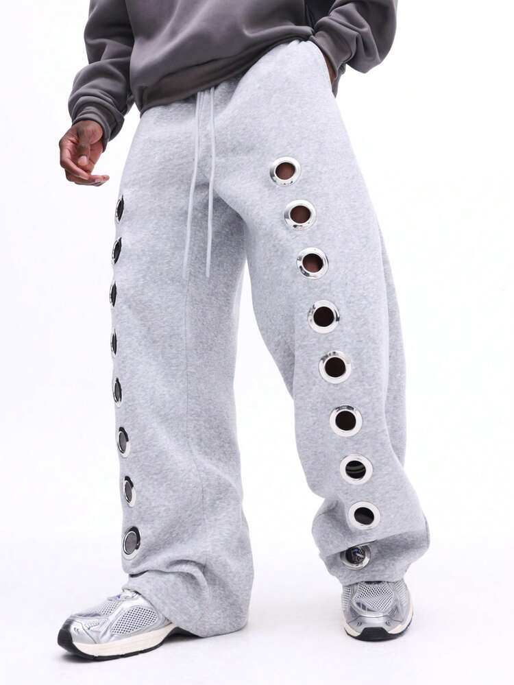 Pantalon de survêtement à œillets métalliques