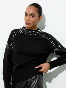Maija 女士宽松珍珠装饰长袖毛衣，经典黑色搭配亮片点缀，时尚优雅。适合休闲、社交场合，也是秋季百搭单品，尽显女性的优雅与时尚。舒适宽松的版型设计，兼具舒适与活力，不容错过的毛衣。 - 黑色 - 查看 4