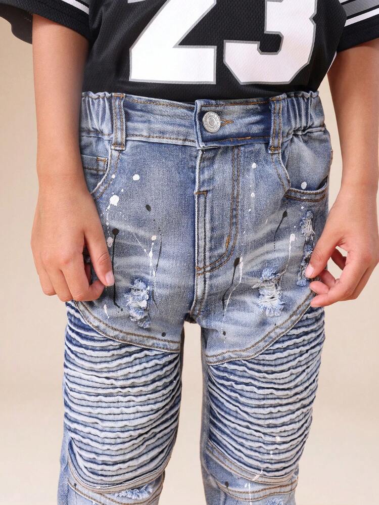 Used-Look-Bikerjeans mit Rippstrick und Farbspritzern