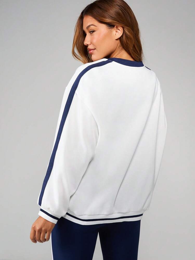 Missguided x Playboy Vintage Inspired Varsity Style Crew Neck Long Sleeve Sweatshirt With Athletic Number Print And Contrast Stripe Detailing For Casual Everyday Wear