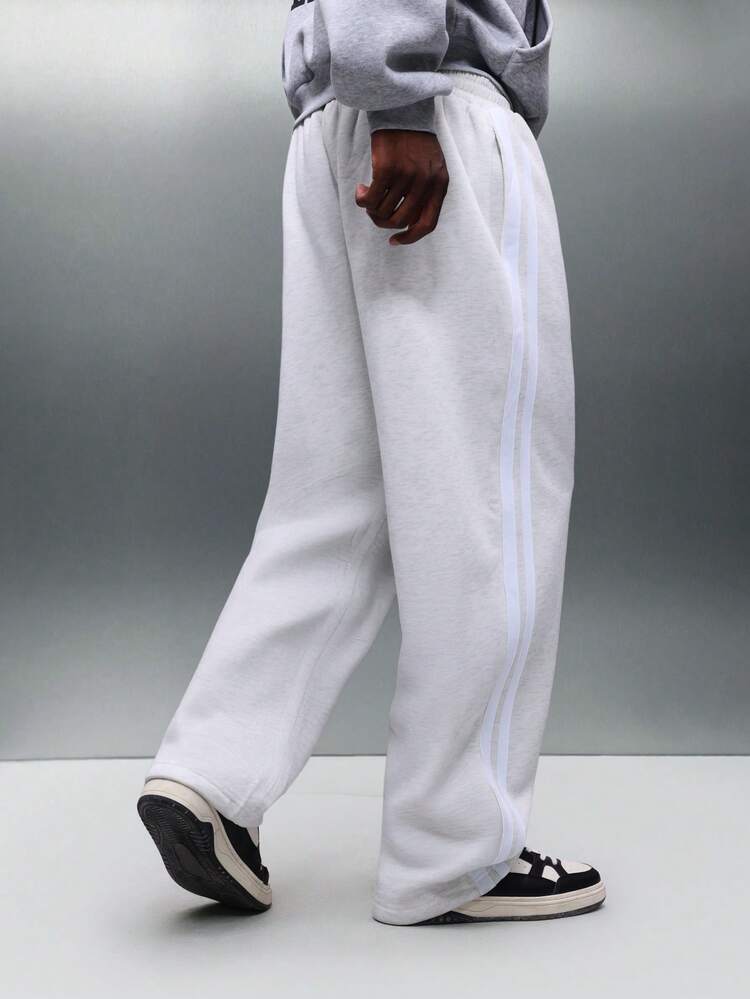 PLAYBOY X SUMWON Relaxed Fit Sweatpants With Side Stripe Detail And Small Logo Embroidery For Casual Loungewear And Weekend Comfort