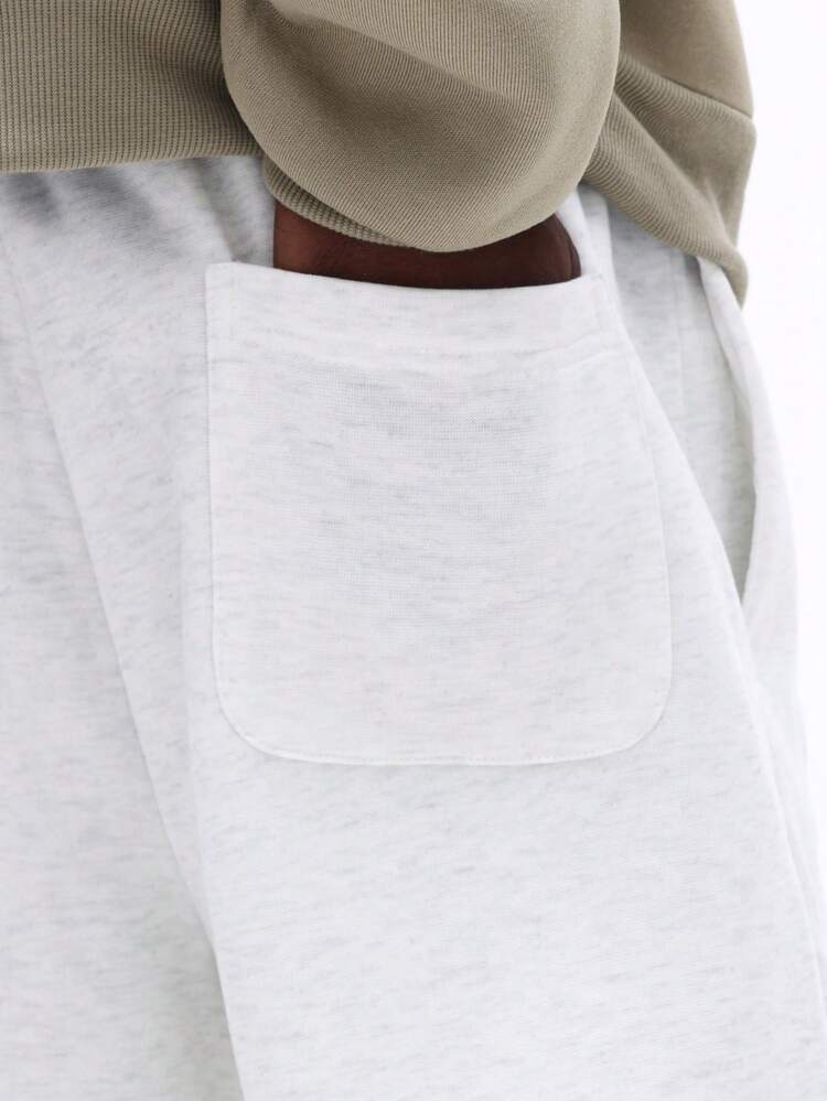 Pantaloni della tuta grigio mélange con coulisse e polsini