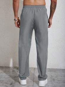 Manfinity Homme Men's Sporty Casual Wear, Featuring An INS-Style Package Of Straight-Leg Casual Pants With A Simple Woven Label Design That Offers Great Value. These Pants Have A Drawstring Design, Making Them Suitable For Music Festivals And Everyday Wear, For Fall - Grey - View 2