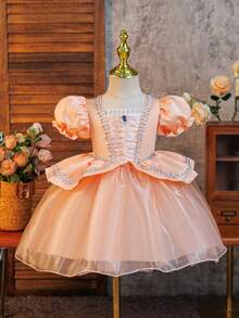 SHEIN Glamorique Kids Váy công chúa màu hồng cam, váy dạ hội, váy công chúa cho bé gái dự tiệc sinh nhật, lễ hội, tay bồng, ruy băng bạc phía trước, vải mềm, chân váy vải tuyn màu hồng cam, đá quý màu hồng cam, thích hợp cho sân khấu, biểu diễn, Trung Đông, Châu Âu & Châu Mỹ, mọi mùa - Màu Cam san hô - Xem 3