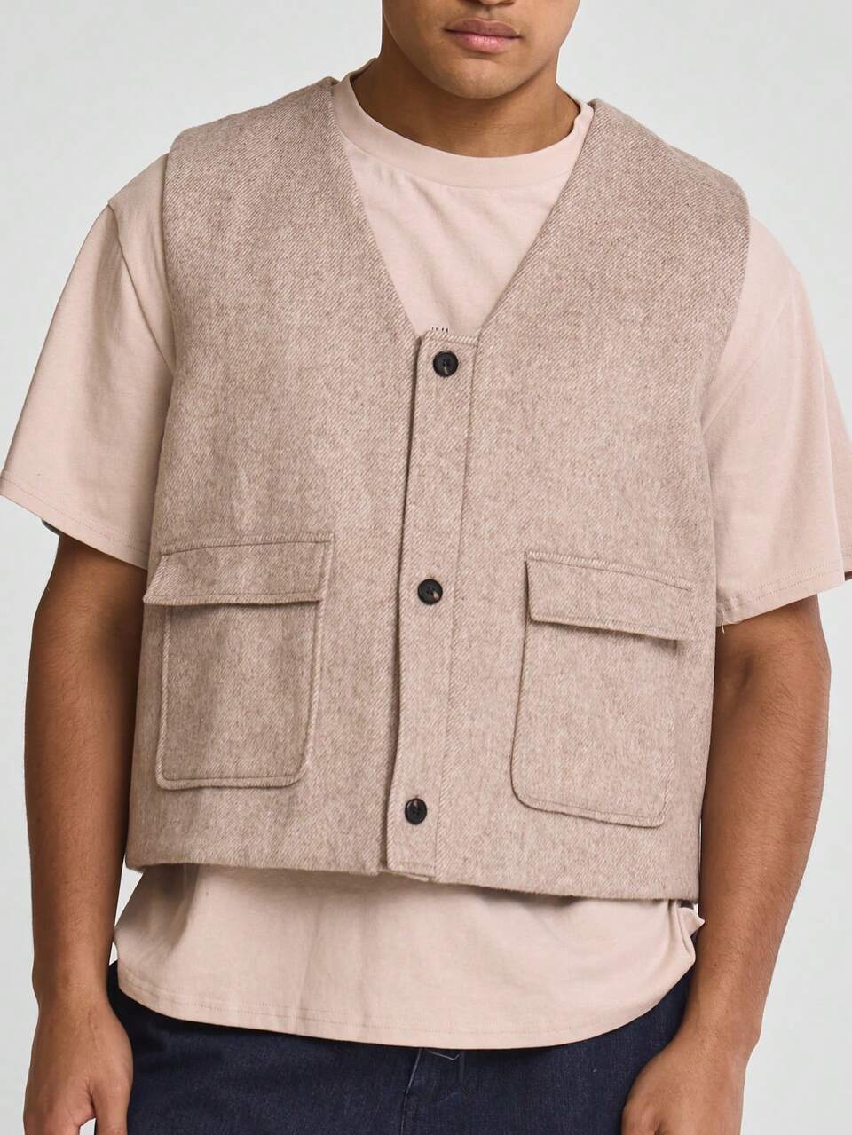 Parte superior con bolsillo, abotonadura frontal, sin mangas y cuello en V, para usar como capa en el armario cápsula de primavera y verano