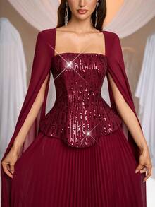 Aureia Sang trọng, quyến rũ, lãng mạn và thời trang, chiếc đầm chiffon thêu sequin màu đỏ tía này có cổ vuông, tay áo bồng bềnh, thiết kế 2 trong 1 và chân váy xếp ly rộng. Phù hợp cho mọi dịp trang trọng, bao gồm đám cưới, tiệc sinh nhật và những buổi dạ hội lộng lẫy. Đầm dạ hội trang trọng - Màu Đỏ Sâu - Xem 5