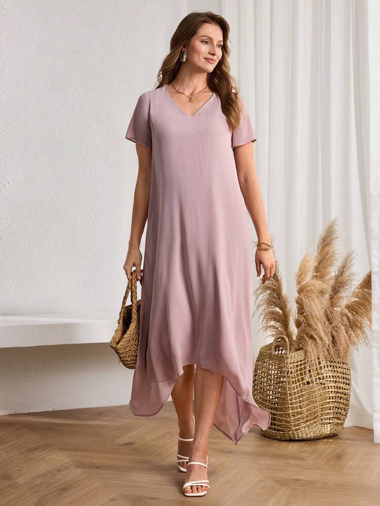 This Elegant Women's Spring/Summer Dress Features A Soft, Light Purple Hue, Exuding A Romantic Feel And Serving As A Refreshing Base For Spring And Summer Looks. The Floral Pattern Is A Solid Color Design With A Flowing Fabric, Conveying A Light And Airy Feel Through Its Simplicity. The V-Neck Short Sleeves And Asymmetrical Hem Create A Relaxed Silhouette That Flatters Various Body Types, While The Flowing Skirt Adds A Touch Of Dynamism. Perfect For Spring And Summer, This Dress Is Ideal For Casual Vacations And Relaxed Outings. The Light Purple Base Conveys A Gentle Style, While The Asymmetrical Design Showcases A Fashionable And Effortless Taste, Making It A Top Choice For Your Spring/Summer Wardrobe That Combines Comfort And Style.