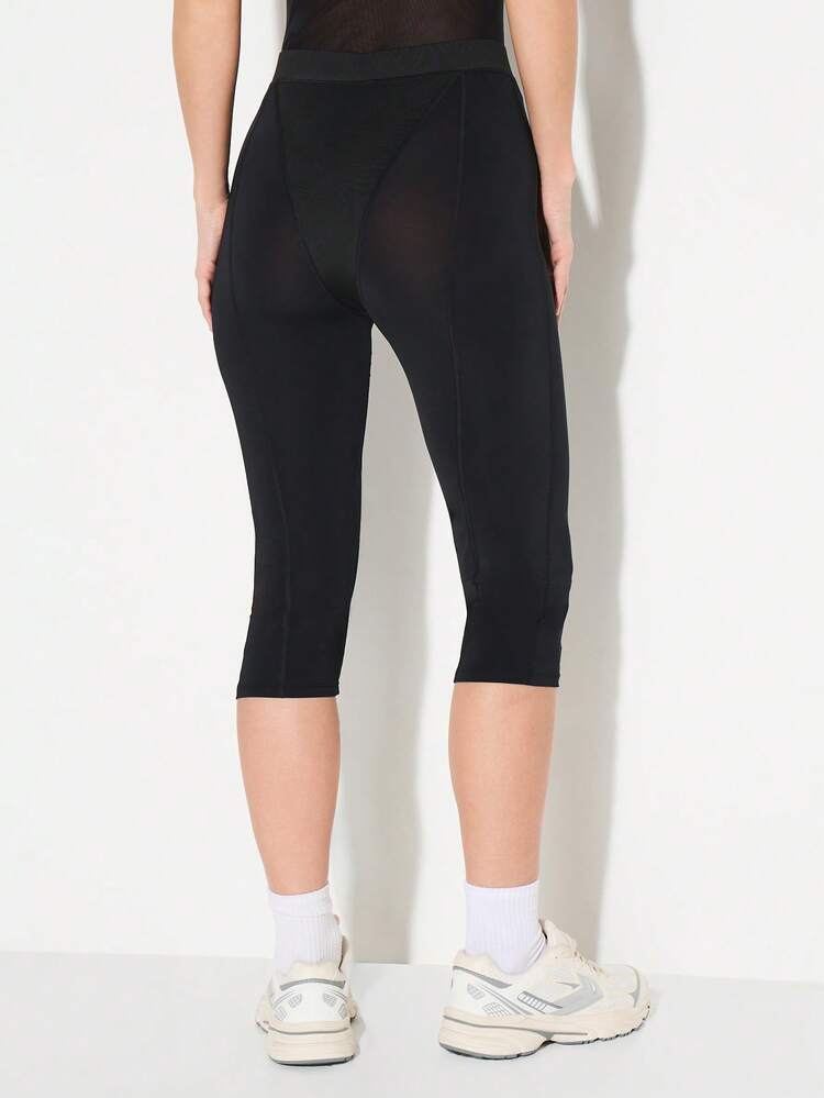 KIZN Legging Capri à empiècements en résille avec logo