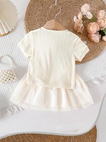 SHEIN 2pcs Baby Girls Apricot Knit Short Sleeve Top Decorated With Multiple White Bows, Paired With Matching Mesh Skirt, Sweet & Cute Overall Style, Simple & Fashionable, Versatile For Comfortable Summer Outings