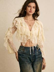 Poéselle Áo kiểu croptop ren xếp ly thắt nơ phía trước dành cho nữ – Màu trắng ngà, tay dài, phong cách boho lãng mạn cho phong cách cottagecore và hẹn hò. Áo kiểu ren xếp ly thắt nơ phía trước, áo ren màu trắng ngà, phong cách boho lãng mạn, cottagecore, áo ren cổ điển, áo croptop tay dài dành cho nữ, áo hẹn hò, áo kiểu ren xếp ly nhiều lớp tay dài thắt nơ phía trước, áo mùa hè, áo cho năm mới, kỳ nghỉ biển, ngày Valentine. - Màu be - Xem 4