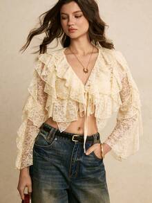 Poéselle Áo kiểu croptop ren xếp ly thắt nơ phía trước dành cho nữ – Màu trắng ngà, tay dài, phong cách boho lãng mạn cho phong cách cottagecore và hẹn hò. Áo kiểu ren xếp ly thắt nơ phía trước, áo ren màu trắng ngà, phong cách boho lãng mạn, cottagecore, áo ren cổ điển, áo croptop tay dài dành cho nữ, áo hẹn hò, áo kiểu ren xếp ly nhiều lớp tay dài thắt nơ phía trước, áo mùa hè, áo cho năm mới, kỳ nghỉ biển, ngày Valentine. - Màu be - Xem 7