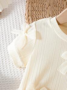 SHEIN 2pcs Baby Girls Apricot Knit Short Sleeve Top Decorated With Multiple White Bows, Paired With Matching Mesh Skirt, Sweet & Cute Overall Style, Simple & Fashionable, Versatile For Comfortable Summer Outings