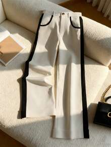 这款极简撞色慵懒垂坠休闲裤采用高腰阔腿设计，巧妙遮掩赘肉，拉长身形，是通勤和休闲穿着的理想之选。垂坠面料不易起皱，是懒人必备，轻松打造纤长美腿的视觉效果。