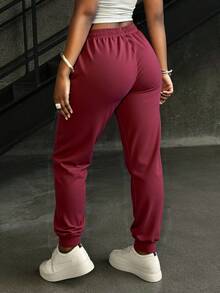 Pantalones deportivos para mujeres - pantalones de cinturón elástico ajustados por cuerda de extracción, con bolsillos, tejidos sólidos, 100% poliéster suave, ligero, cómodo y transpirable, adecuado para deportes de fitness dentro y fuera del hogar - Burdeos - Ver 2