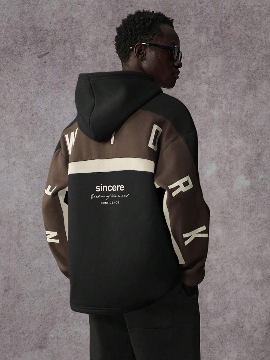 STYNVO Sudadera con capucha casual de moda para hombres, con estampado de letras y contraste de colores, hombros caídos, suelta y forrada térmicamente, para otoño/invierno, sudadera con gráficos de moda urbana - Negro - Ver 1