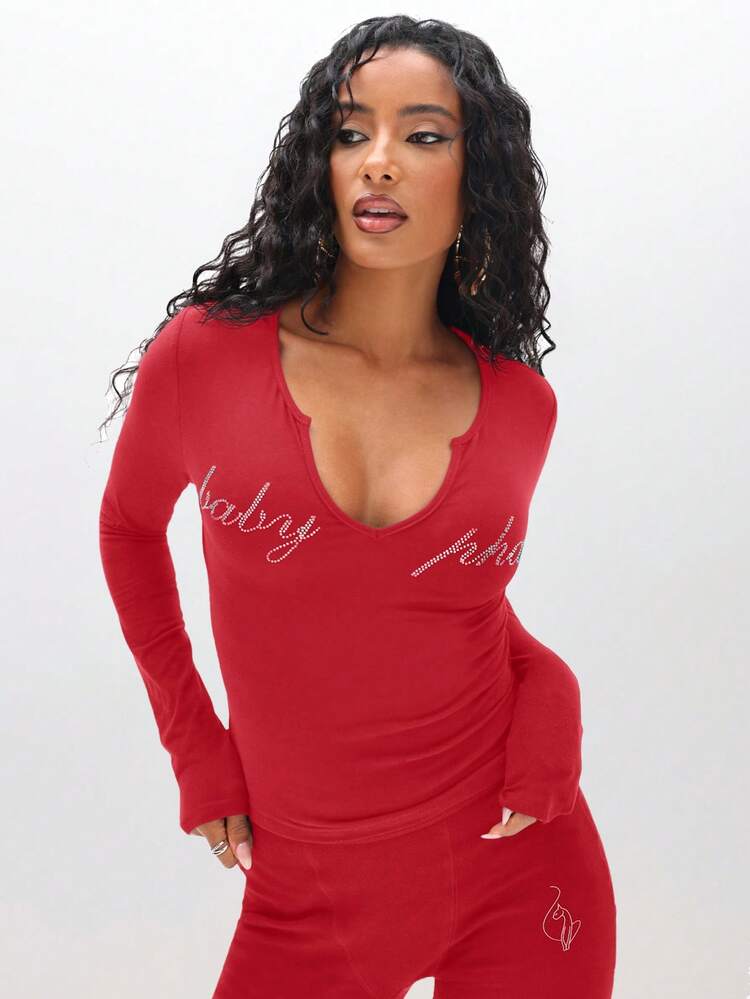 BABYPHAT Long Sleeve Notch V Neck Top With Rhinestone Text And Metallic Accent Details For Holiday Party