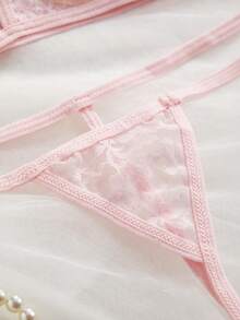 Conjunto de lencería con top corto con tirantes finos y espalda descubierta con cruce y tanga para mujer - Rosa - Ver 3