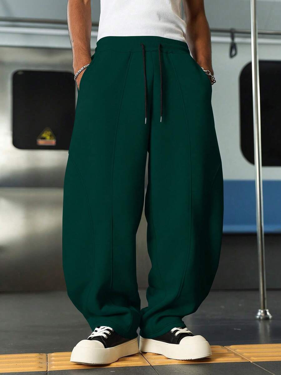 Manfinity EMRG Pantalones de chándal casuales para hombres de unicolor con cordón en la cintura y bajo curvo - Verde Oscuro - Ver 1